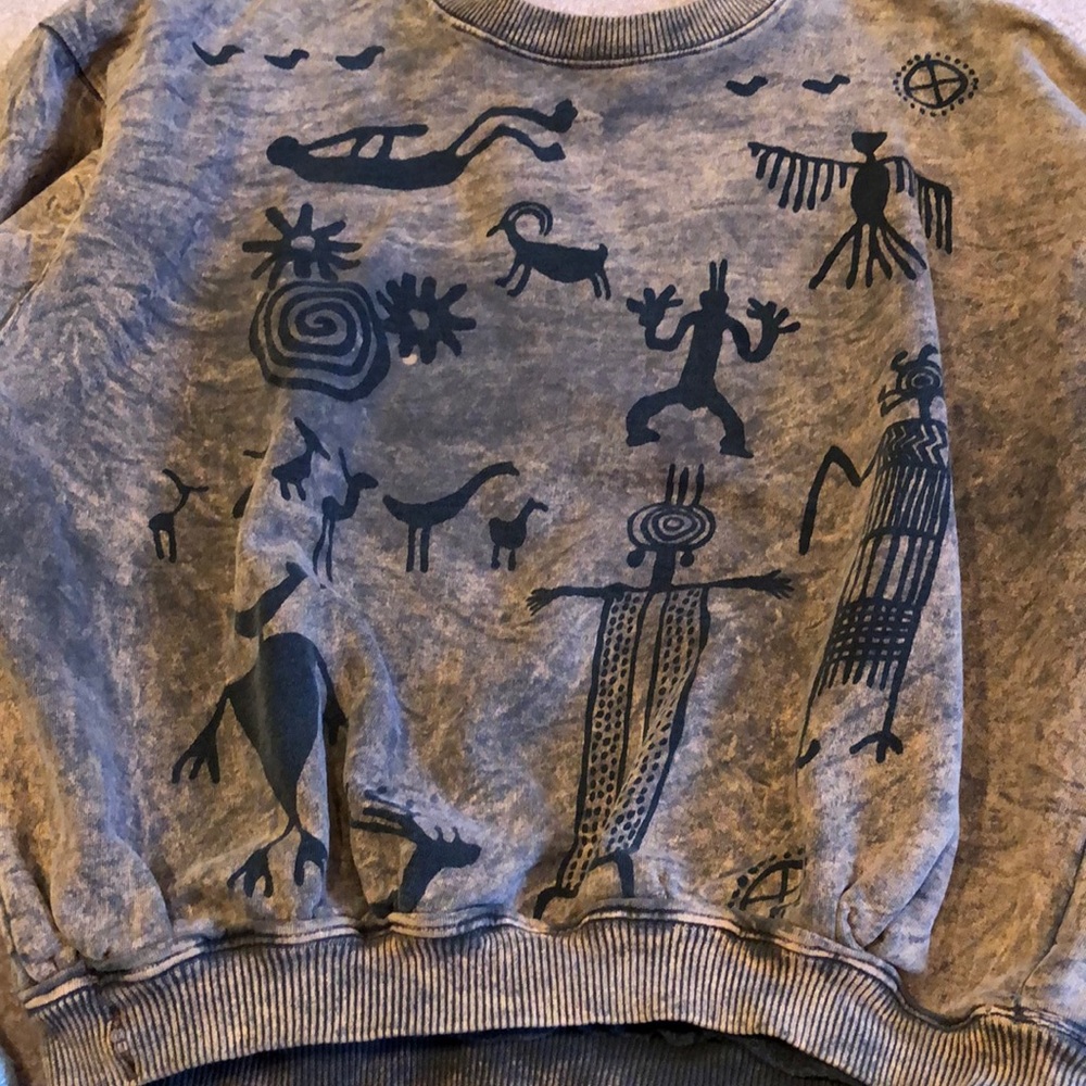 Tribal carvings crew distressed sweater